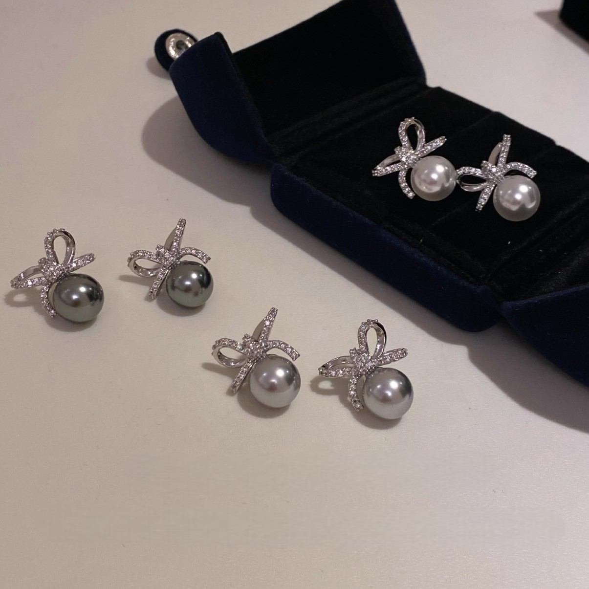 ZIRCON-SET BOW PEARL EARRINGS