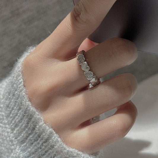 INTERLOCKED HEART RING
