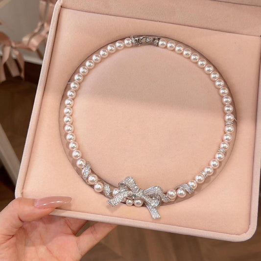 ZIRCON-WRAPPED PEARL BOW NECKLACE