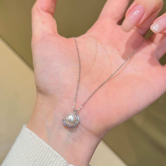 CRESCENT MOON EMBRACING PEARL NECKLACE